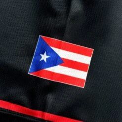 Puerto Rico 'Flor De Maga' Baseball Jersey 26 Puerto Rico 'Flor De Maga' Baseball Jersey -World of Sportswear Puerto Rico Flor de Maga Black Baseball Jersey Closeup